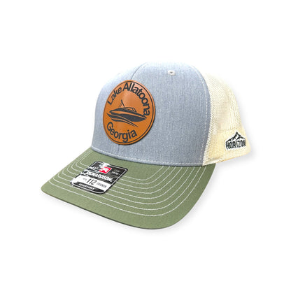 Angled view of Lake Allatoona patch hat by Horizon Hat Co. in gray/birch/olive showing the curved bill and side panels