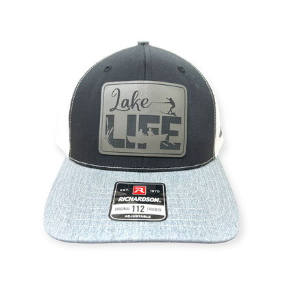 Front view of Lake Life patch hat by Horizon Hat Co. in black/white/gray showing lake life lettering and dockside-inspired patch artwork