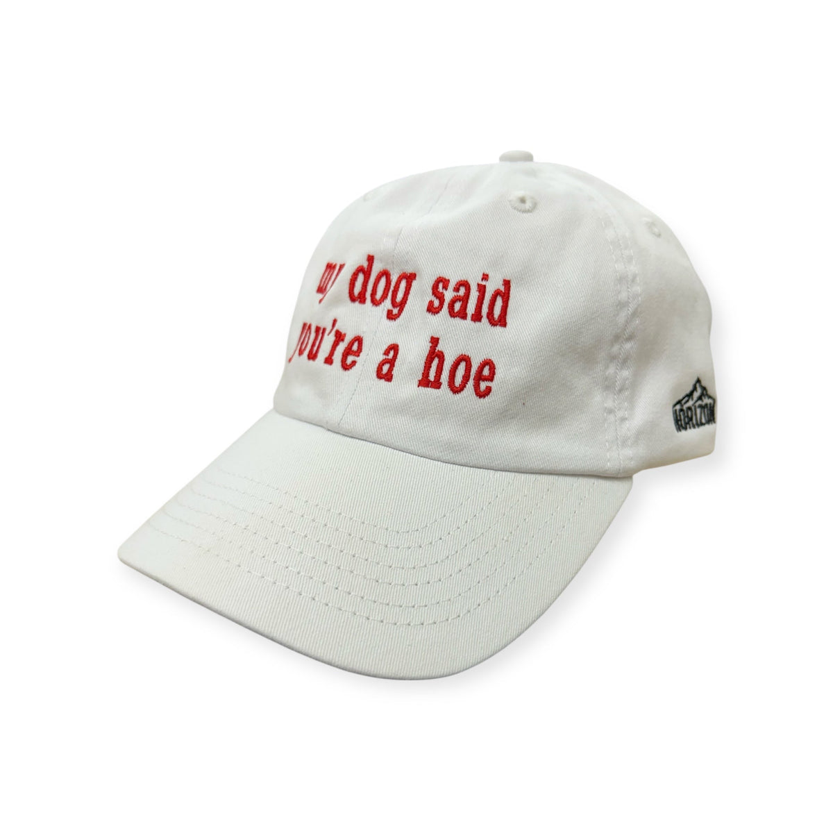 Angled view of My Dog Said You're a Hoe embroidered cap by Horizon Hat Co. in white showing the bill and side panels