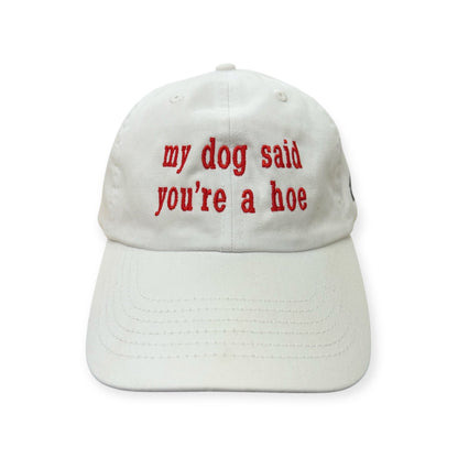 Front view of My Dog Said You're a Hoe embroidered cap by Horizon Hat Co. in white showing red my dog said you're a hoe front embroidery
